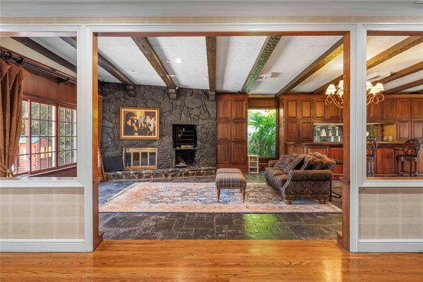 Chandelier, Fireplace, Interior, Living room, Stone Walls, Wooden Beams, Wood Texture Flooring