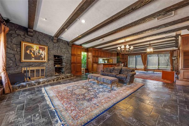 Chandelier, Fireplace, Interior, Living room, Recessed Lighting, Stone Walls, Wooden Beams, Wooden Walls