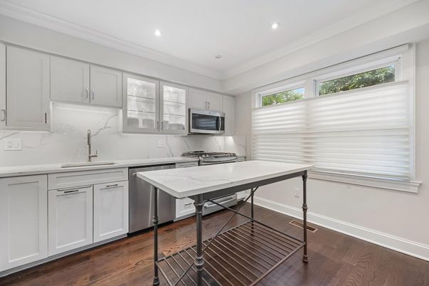 Interior, Kitchen, Marble Walls, Recessed Lighting, Stainless Steel Appliances, Wood Texture Flooring