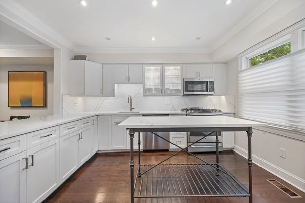 Interior, Kitchen, Marble Walls, Recessed Lighting, Stainless Steel Appliances, Wood Texture Flooring