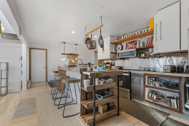 Dining room, Interior, Kitchen, Pendant Lights, Recessed Lighting, Stainless Steel Appliances, Wood Texture Flooring