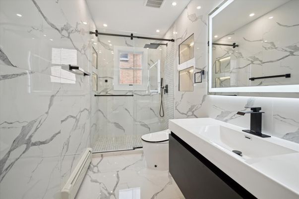 Bathroom, Dual Sink Vanities, Glass Shower, Interior, Marble, Marble Walls, Recessed Lighting