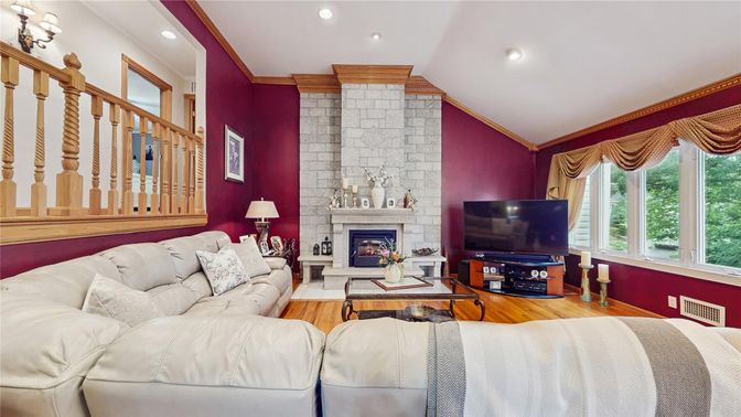 Fireplace, Interior, Living room, Recessed Lighting, Stone Walls, Wood Texture Flooring