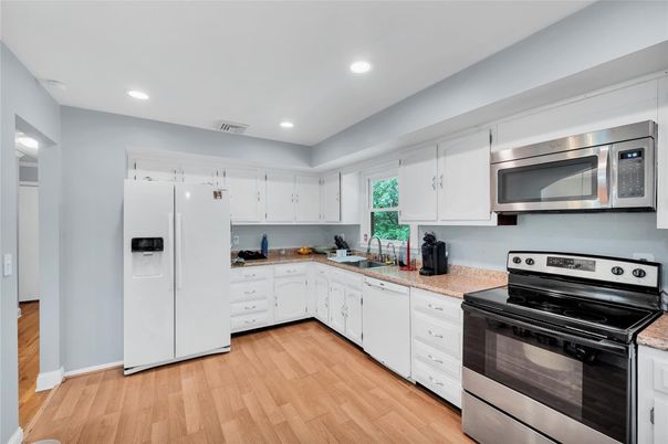 Interior, Kitchen, Recessed Lighting, Stainless Steel Appliances, Wood Texture Flooring
