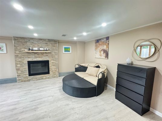 Fireplace, Interior, Recessed Lighting, Stone Walls, Wood Texture Flooring