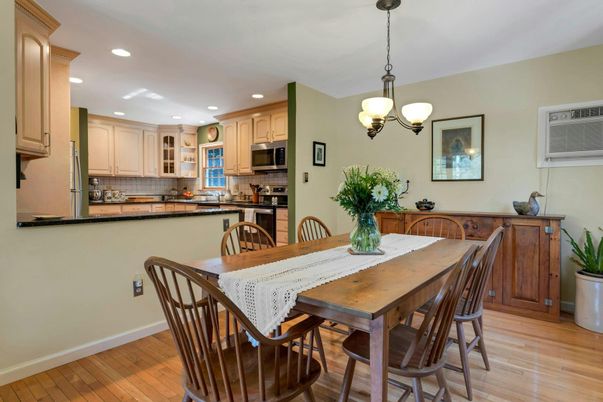 Chandelier, Dining room, Interior, Kitchen, Pendant Lights, Recessed Lighting, Stainless Steel Appliances, Wood Texture Flooring