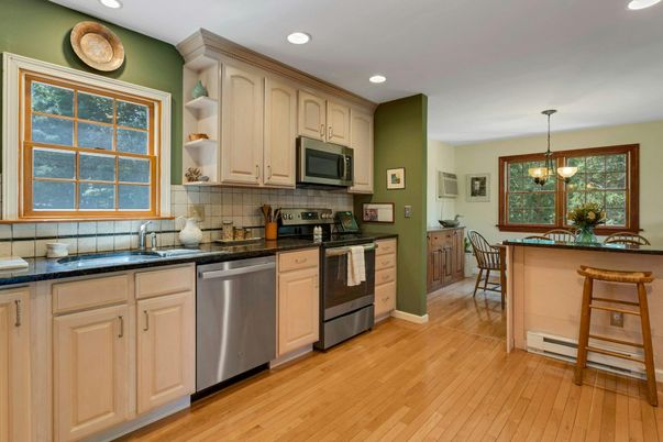 Dining room, Interior, Kitchen, Pendant Lights, Recessed Lighting, Stainless Steel Appliances, Wood Texture Flooring