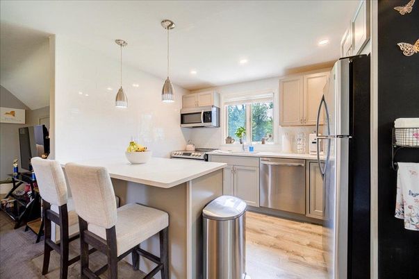 Interior, Kitchen, Pendant Lights, Recessed Lighting, Stainless Steel Appliances, Wood Texture Flooring