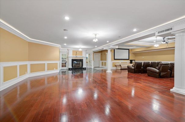 Empty room, Fireplace, Interior, Projection Screen, Recessed Lighting, Wood Texture Flooring