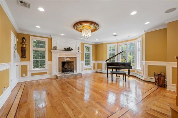 Chandelier, Fireplace, Interior, Piano, Recessed Lighting, Wood Texture Flooring