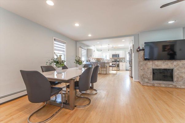 Dining room, Fireplace, Interior, Kitchen, Pendant Lights, Recessed Lighting, Wood Texture Flooring