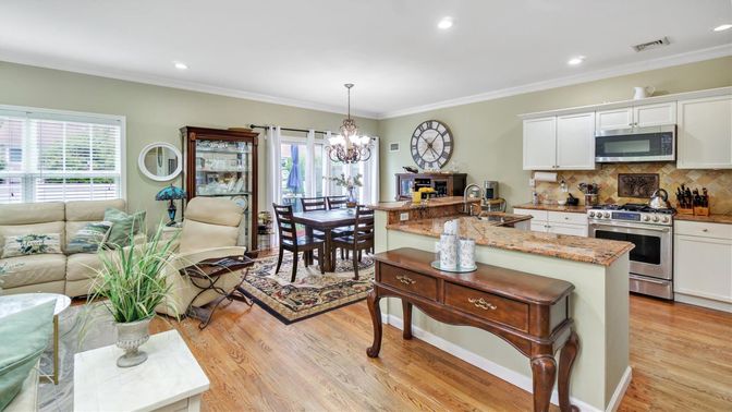 Chandelier, Dining room, Interior, Kitchen, Living room, Recessed Lighting, Stainless Steel Appliances, Wood Texture Flooring