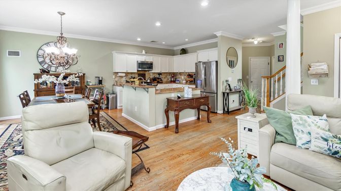 Chandelier, Dining room, Interior, Kitchen, Living room, Recessed Lighting, Stainless Steel Appliances, Wood Texture Flooring