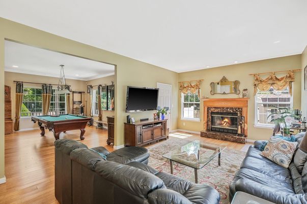 Billiard Table, Fireplace, Game Room, Interior, Living room, Pendant Lights, Recessed Lighting, Wood Texture Flooring