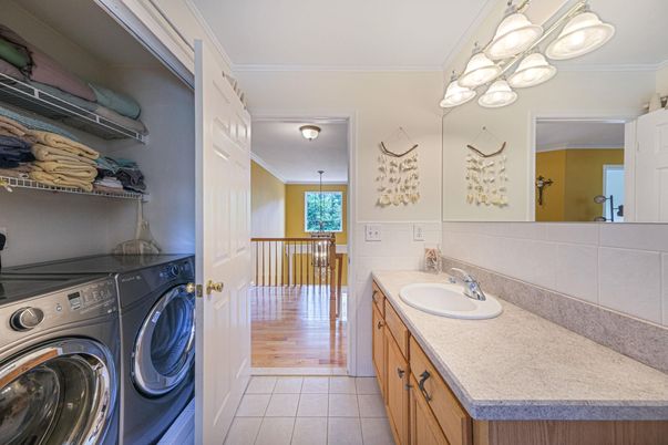 Bathroom, Dual Sink Vanities, Interior, Washer, Wood Texture Flooring