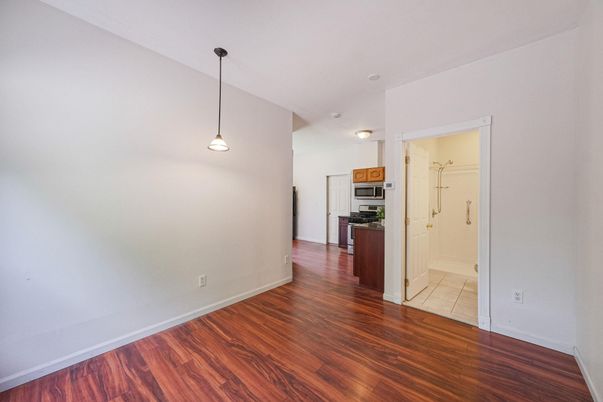 Empty room, Interior, Kitchen, Pendant Lights, Stainless Steel Appliances, Wood Texture Flooring