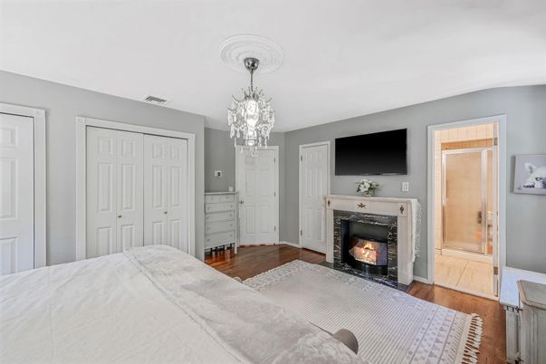 Bedroom, Chandelier, Fireplace, Interior, Wood Texture Flooring