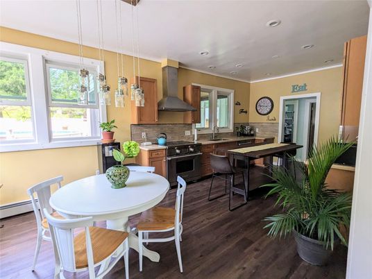 Dining room, Interior, Kitchen, Pendant Lights, Recessed Lighting, Stainless Steel Appliances, Wood Texture Flooring