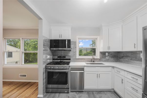 Interior, Kitchen, Marble Walls, Stainless Steel Appliances, Wood Texture Flooring