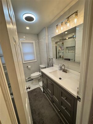 Bathroom, Dual Sink Vanities, Interior, Marble Walls, Recessed Lighting