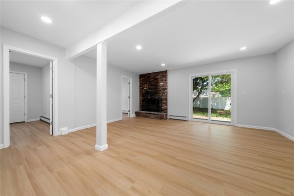 Empty room, Fireplace, Interior, Recessed Lighting, Stone Walls, Wood Texture Flooring
