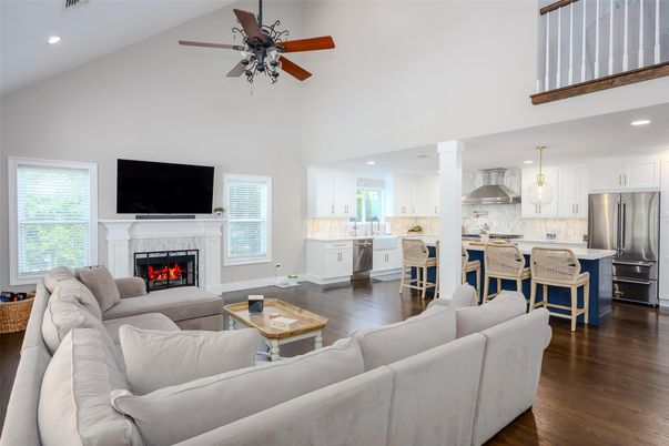 Fireplace, Interior, Kitchen, Living room, Pendant Lights, Recessed Lighting, Stainless Steel Appliances, Wood Texture Flooring