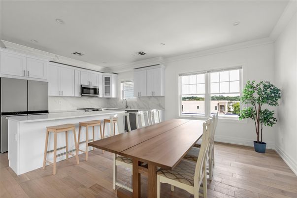 Dining room, Interior, Kitchen, Marble Walls, Recessed Lighting, Stainless Steel Appliances, Wood Texture Flooring