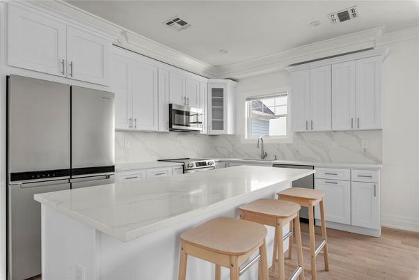 Interior, Kitchen, Marble Walls, Recessed Lighting, Stainless Steel Appliances, Wood Texture Flooring