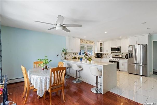 Dining room, Interior, Kitchen, Marble, Recessed Lighting, Stainless Steel Appliances, Wood Texture Flooring