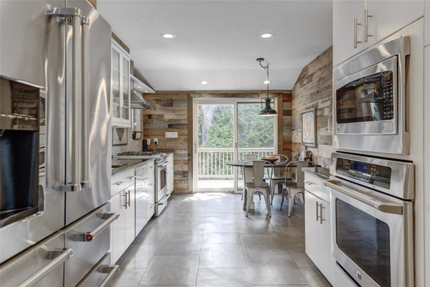 Dining room, Interior, Kitchen, Pendant Lights, Recessed Lighting, Stainless Steel Appliances, Stone Walls, Wooden Walls