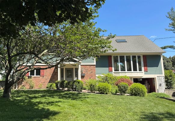 Exterior, Facade, Brick Facade, Raised Ranch