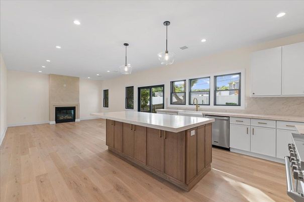 Fireplace, Interior, Kitchen, Pendant Lights, Recessed Lighting, Stainless Steel Appliances, Wood Texture Flooring