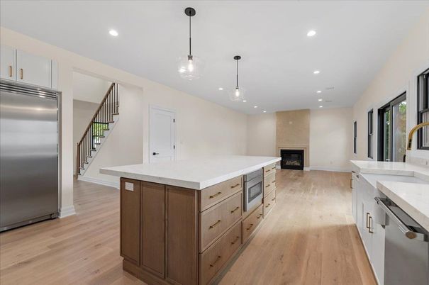Fireplace, Interior, Kitchen, Pendant Lights, Recessed Lighting, Stainless Steel Appliances, Wood Texture Flooring