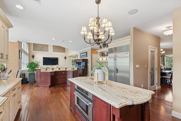 Chandelier, Interior, Kitchen, Recessed Lighting, Stainless Steel Appliances, Wood Texture Flooring
