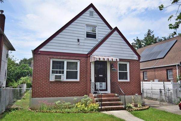 Exterior, Facade, Brick Facade, Solar Panels, Tudor Revival