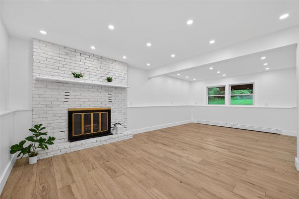 Empty room, Fireplace, Interior, Recessed Lighting, Stone Walls, Wood Texture Flooring