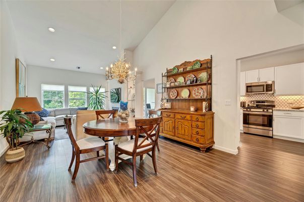 Chandelier, Dining room, Interior, Kitchen, Living room, Recessed Lighting, Stainless Steel Appliances, Wood Texture Flooring