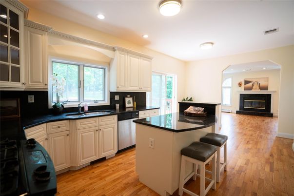 Fireplace, Interior, Kitchen, Recessed Lighting, Wood Texture Flooring