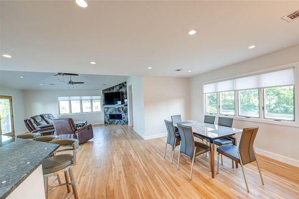 Dining room, Fireplace, Interior, Living room, Recessed Lighting, Wood Texture Flooring