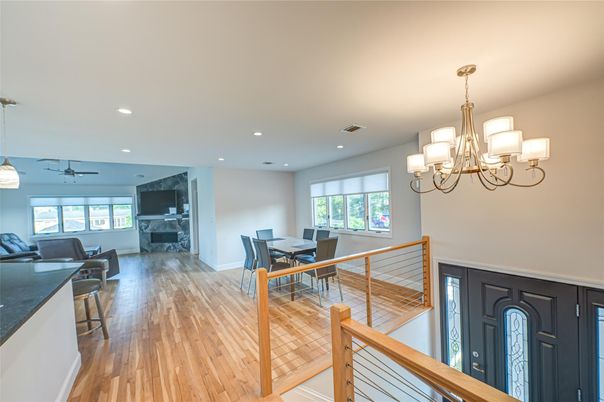 Chandelier, Dining room, Fireplace, Interior, Living room, Recessed Lighting, Wood Texture Flooring