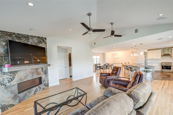 Dining room, Fireplace, Interior, Kitchen, Living room, Pendant Lights, Recessed Lighting, Stainless Steel Appliances, Wood Texture Flooring