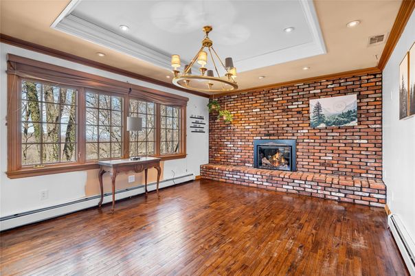 Empty room, Fireplace, Interior, Recessed Lighting, Stone Walls, Wood Texture Flooring