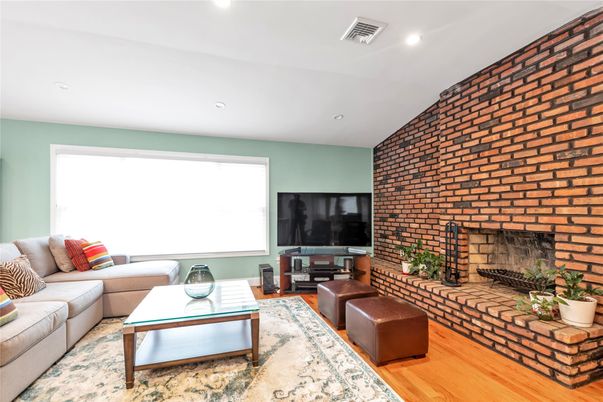 Fireplace, Interior, Living room, Recessed Lighting, Stone Walls, Wood Texture Flooring
