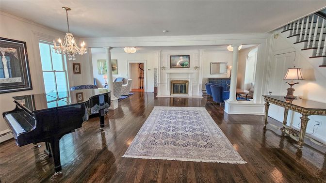 Chandelier, Fireplace, Interior, Living room, Piano, Recessed Lighting, Wood Texture Flooring