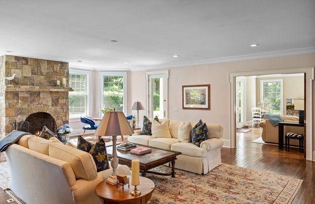 Fireplace, Interior, Living room, Recessed Lighting, Stone Walls, Wood Texture Flooring