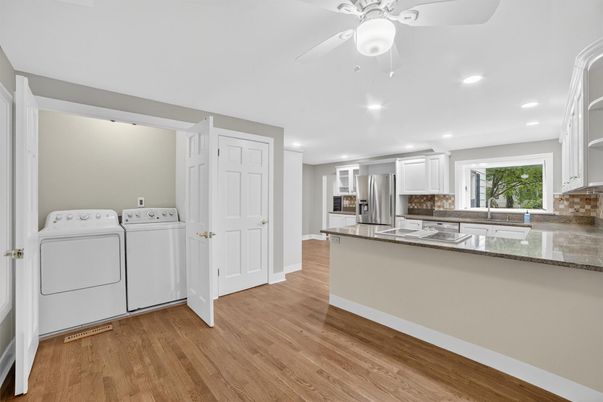 Interior, Kitchen, Recessed Lighting, Washer, Wood Texture Flooring