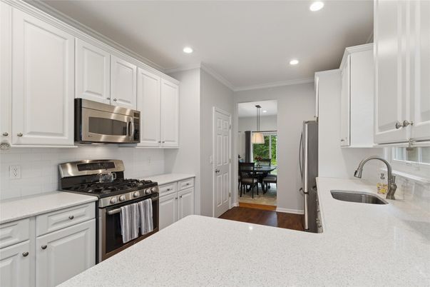 Dining room, Interior, Kitchen, Pendant Lights, Recessed Lighting, Stainless Steel Appliances, Wood Texture Flooring