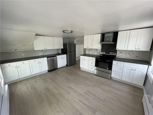 Interior, Kitchen, Marble Walls, Stainless Steel Appliances, Wood Texture Flooring