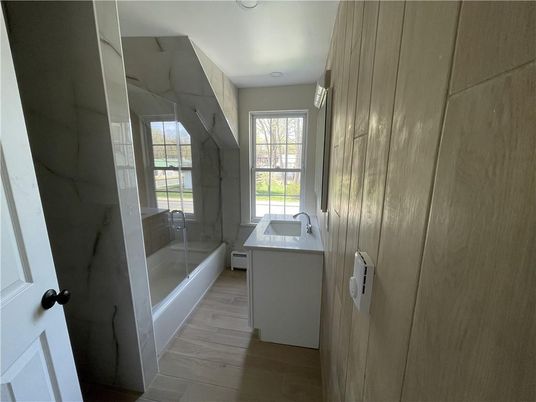 Bathroom, Glass Shower, Interior, Marble Walls, Wood Texture Flooring