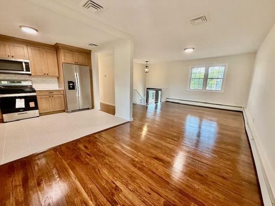 Empty room, Interior, Kitchen, Stainless Steel Appliances, Wood Texture Flooring